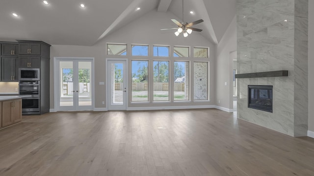 12944 Whitewater Way, Conroe, TX 77302 - unfurnished living room featuring recessed lighting, a ceiling fan, wood finished floors, high vaulted ceiling, and beamed ceiling