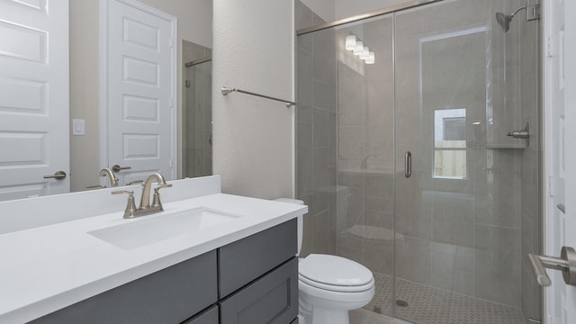 12944 Whitewater Way, Conroe, TX 77302 - bathroom featuring vanity, a stall shower, and a textured wall