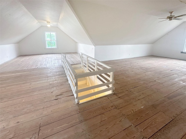 bonus room featuring wood-type flooring, ceiling fan, and vaulted ceiling