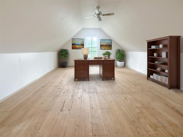 office area with a ceiling fan, vaulted ceiling, and light wood-style flooring