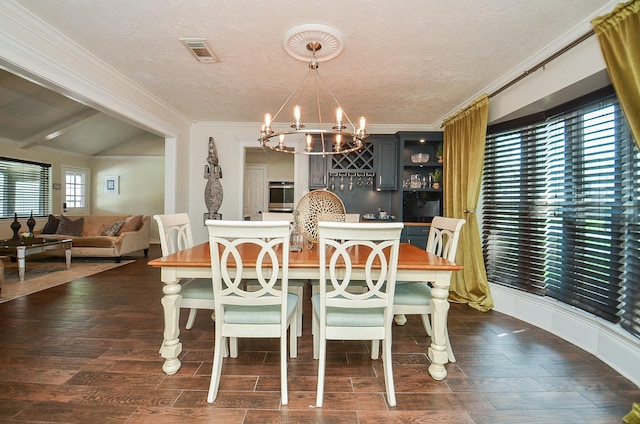 dining space with visible vents, crown molding, an inviting chandelier, dark wood-style floors, and a textured ceiling