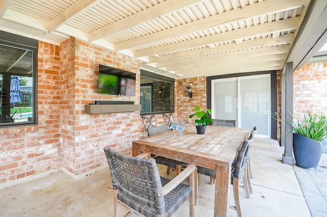 view of patio featuring outdoor dining area