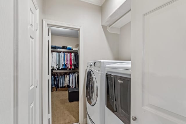washroom featuring laundry area and independent washer and dryer