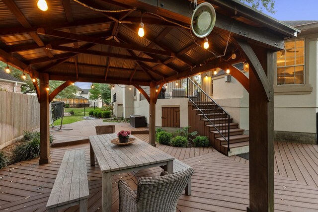 deck with fence, stairs, and a gazebo