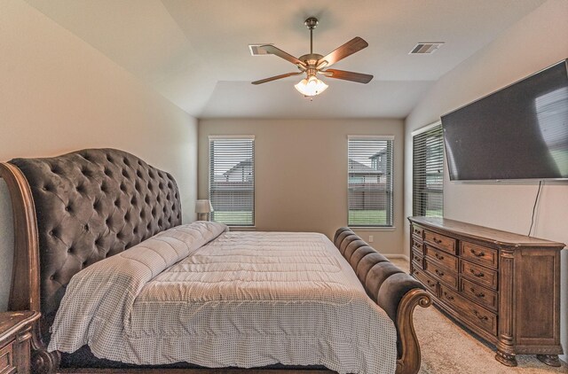 bedroom featuring carpet flooring, ceiling fan, visible vents, and lofted ceiling