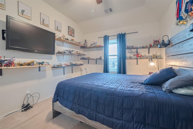 carpeted bedroom with ceiling fan, visible vents, and lofted ceiling