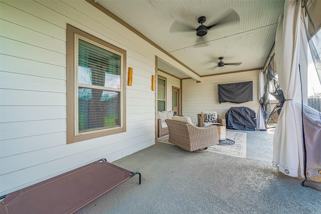 sunroom featuring ceiling fan