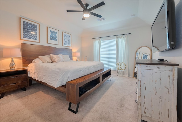 bedroom with a ceiling fan, light colored carpet, and visible vents