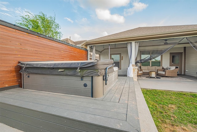 exterior space with a patio area, a hot tub, fence, and an outdoor hangout area