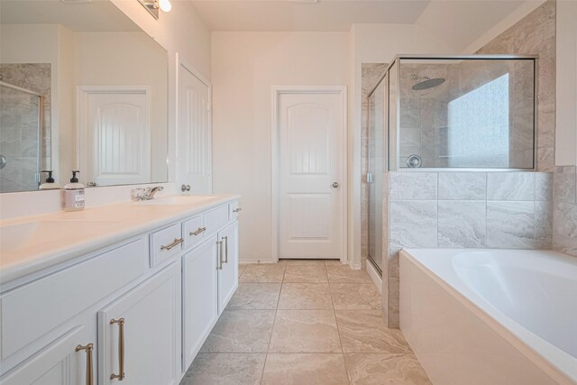 full bath featuring vanity, a stall shower, and a garden tub