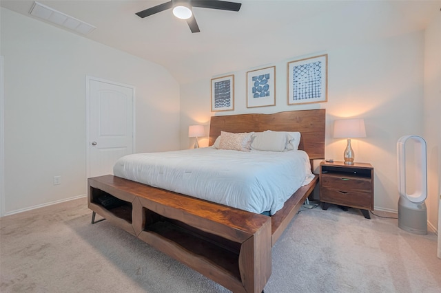 carpeted bedroom featuring visible vents, a ceiling fan, baseboards, and vaulted ceiling