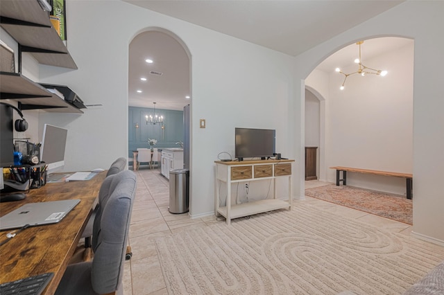 home office featuring light tile patterned floors, arched walkways, visible vents, and a chandelier