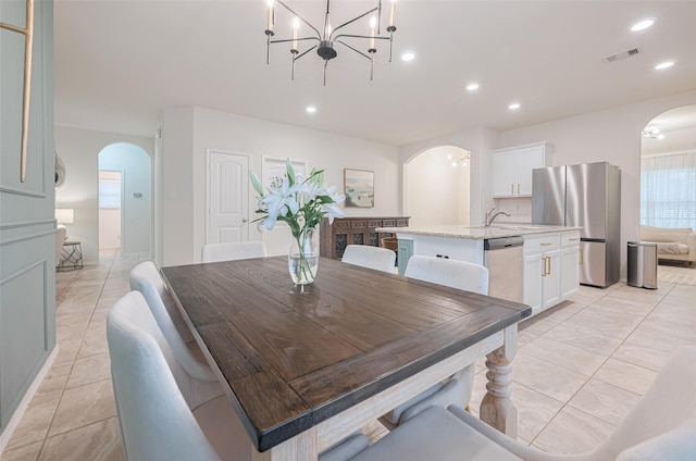 dining room with recessed lighting, arched walkways, light tile patterned floors, and visible vents
