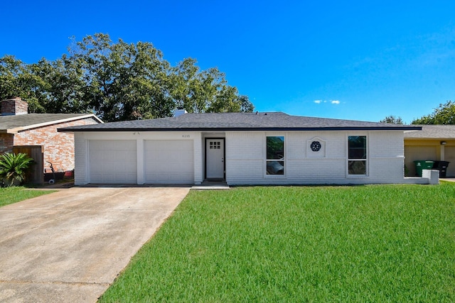 single story home with a shingled roof, an attached garage, brick siding, a front yard, and concrete driveway