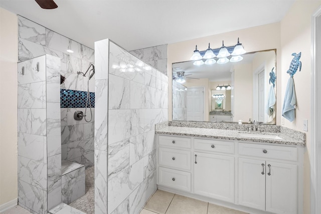 full bathroom with a walk in shower, ceiling fan, tile patterned flooring, and vanity