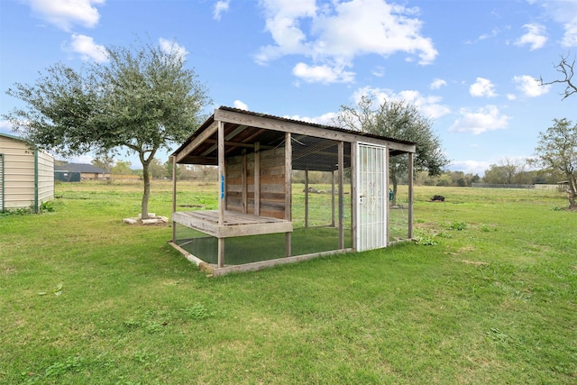 view of poultry coop featuring a yard