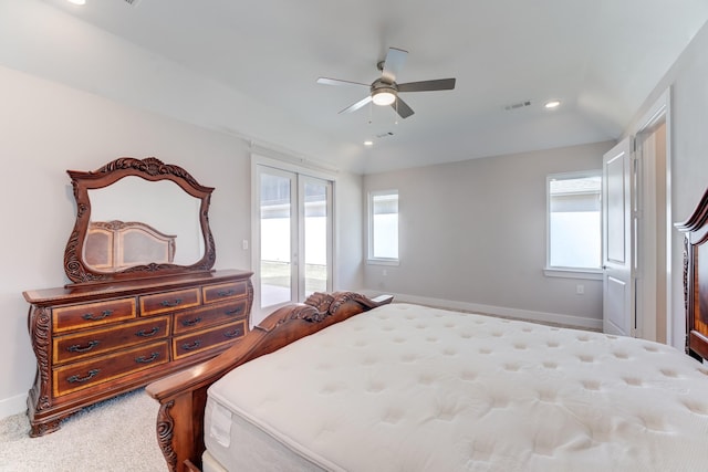 bedroom with carpet flooring, access to outside, visible vents, and multiple windows