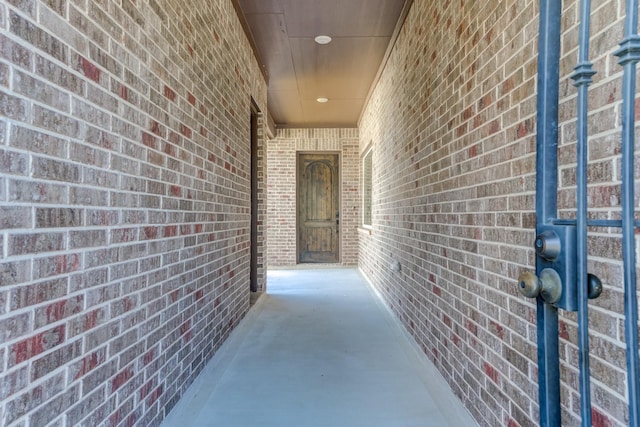 property entrance with brick siding