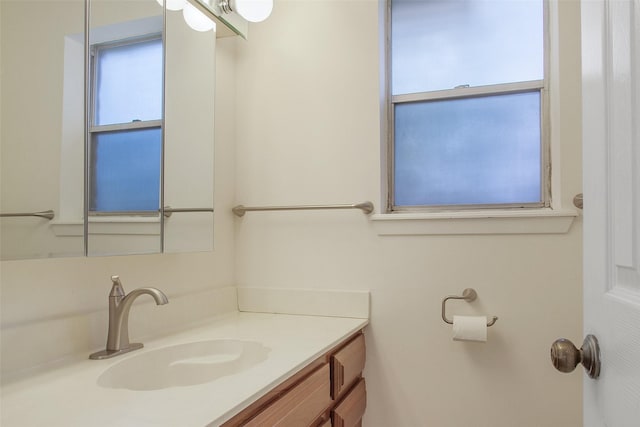 711 Rosewood Dr, Shenandoah, TX 77381 - bathroom with plenty of natural light and vanity