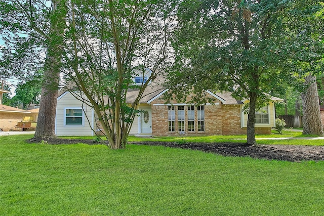 711 Rosewood Dr, Shenandoah, TX 77381 - view of front facade featuring brick siding