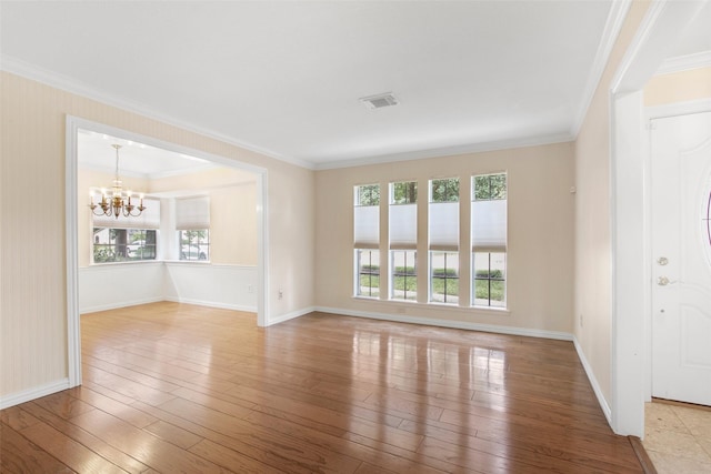 711 Rosewood Dr, Shenandoah, TX 77381 - unfurnished living room featuring baseboards, a chandelier, hardwood / wood-style floors, and ornamental molding