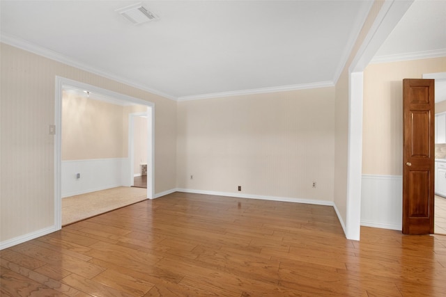 711 Rosewood Dr, Shenandoah, TX 77381 - empty room with light wood-style flooring, crown molding, and baseboards