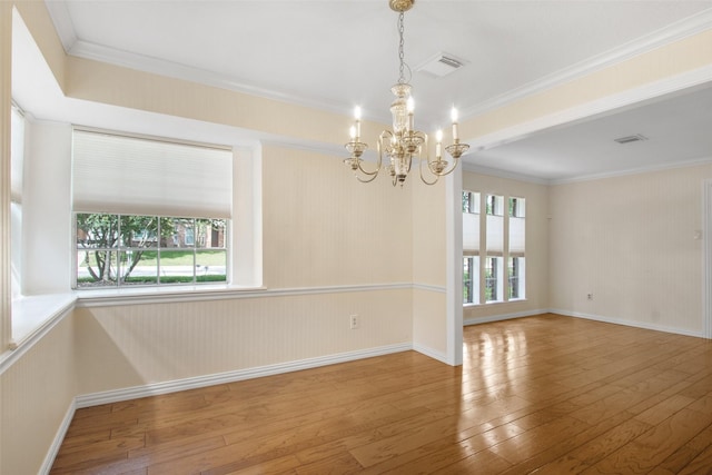 711 Rosewood Dr, Shenandoah, TX 77381 - unfurnished room featuring a chandelier, hardwood / wood-style flooring, crown molding, and baseboards