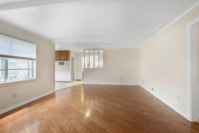 711 Rosewood Dr, Shenandoah, TX 77381 - unfurnished living room featuring light wood-style flooring, crown molding, and baseboards