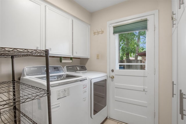 711 Rosewood Dr, Shenandoah, TX 77381 - laundry area with cabinet space and washer and clothes dryer