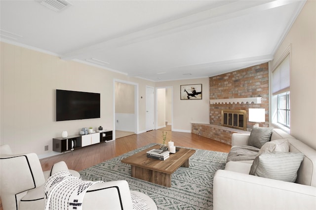 711 Rosewood Dr, Shenandoah, TX 77381 - living room with hardwood / wood-style flooring, ornamental molding, a fireplace, beam ceiling, and baseboards