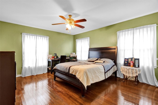 bedroom with ceiling fan and hardwood / wood-style floors