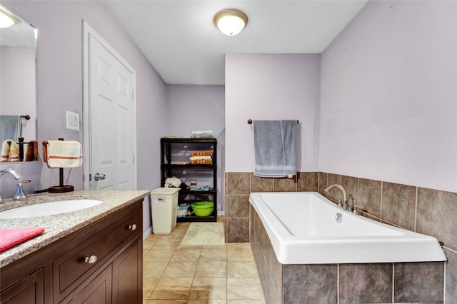 full bath featuring vanity and a bath