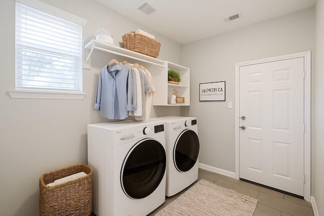 14810 Cascade Bend Ln, Cypress, TX 77429 - laundry area featuring washer and dryer and light tile patterned flooring