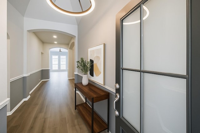 14810 Cascade Bend Ln, Cypress, TX 77429 - hallway featuring wood finished floors and arched walkways