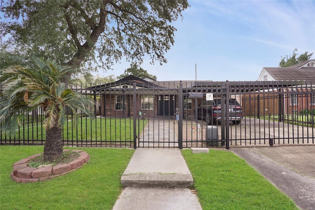 view of front of home with a gate, a front lawn, and a fenced front yard