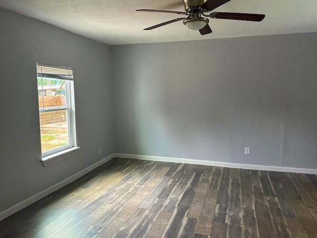 19101 Oak Canyon Dr, Conroe, TX 77385 - empty room with baseboards, ceiling fan, and wood finished floors