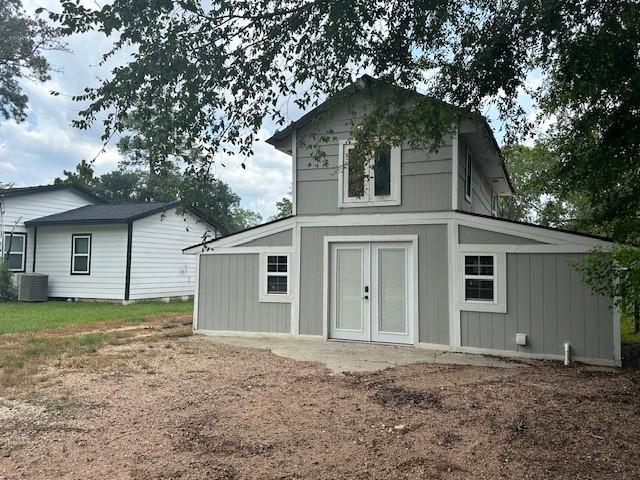 19101 Oak Canyon Dr, Conroe, TX 77385 - view of outdoor structure with french doors and cooling unit