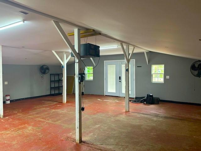 19101 Oak Canyon Dr, Conroe, TX 77385 - bonus room featuring concrete floors and lofted ceiling
