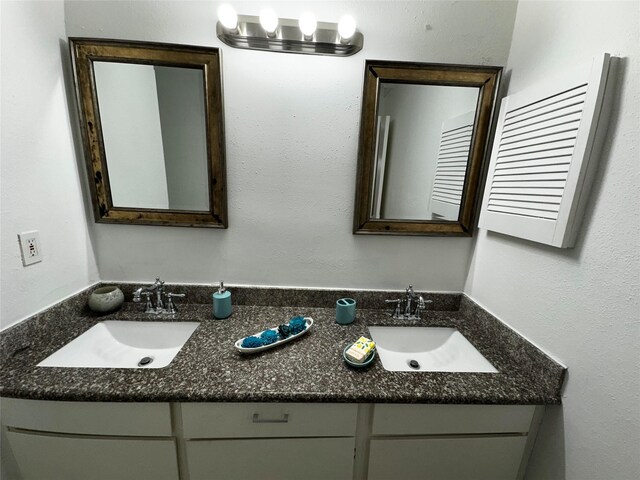 10047 Westpark Dr Unit 73, Houston, TX 77042 - bathroom with a sink and double vanity