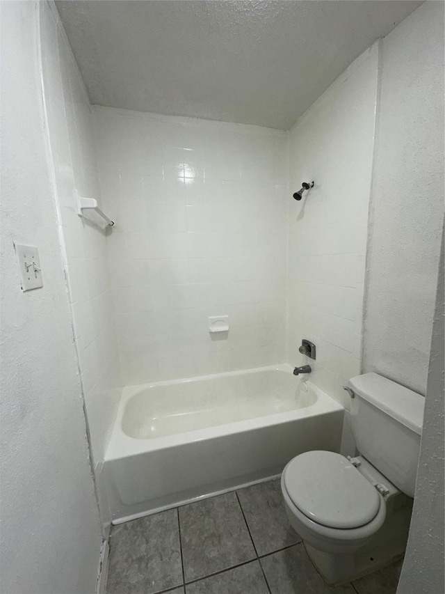 10047 Westpark Dr Unit 73, Houston, TX 77042 - bathroom with tile patterned flooring, bathtub / shower combination, and toilet