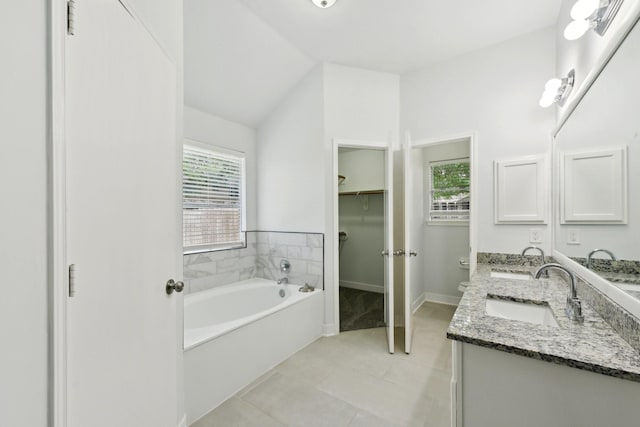 2707 Shawna Lyn Dr, Spring, TX 77373 - bathroom with a sink, a bath, and a healthy amount of sunlight