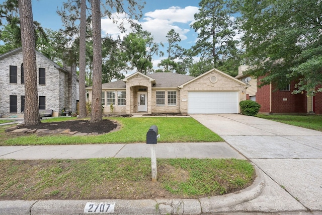 2707 Shawna Lyn Dr, Spring, TX 77373 - view of front of home featuring an attached garage, driveway, and a front yard