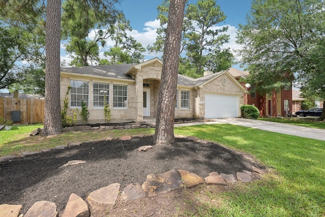 2707 Shawna Lyn Dr, Spring, TX 77373 - single story home featuring a garage, a front lawn, fence, brick siding, and concrete driveway