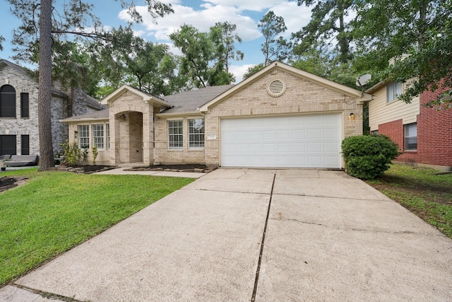 2707 Shawna Lyn Dr, Spring, TX 77373 - view of front of property featuring concrete driveway, brick siding, a front lawn, and a garage