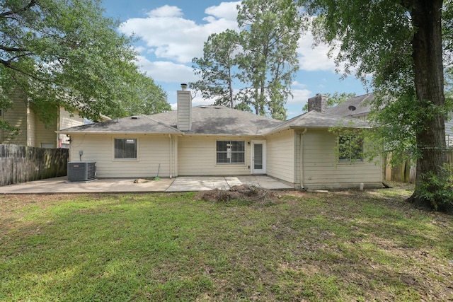 2707 Shawna Lyn Dr, Spring, TX 77373 - rear view of property with fence, a chimney, a patio area, central air condition unit, and a lawn