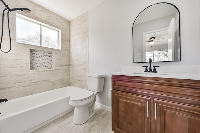 bathroom featuring vanity, baseboards, toilet, and a wealth of natural light