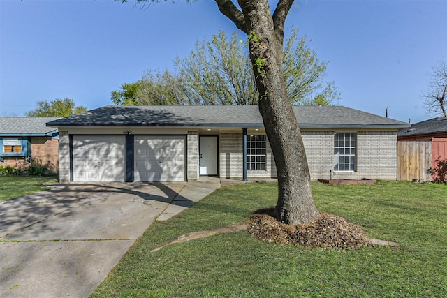 view of front of house featuring fence, an attached garage, a front lawn, brick siding, and concrete driveway