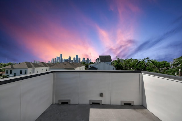 view of balcony at dusk