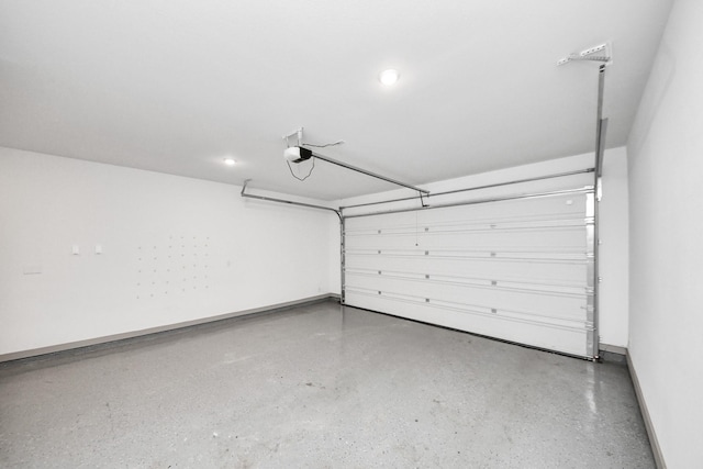 garage with recessed lighting, baseboards, and a garage door opener