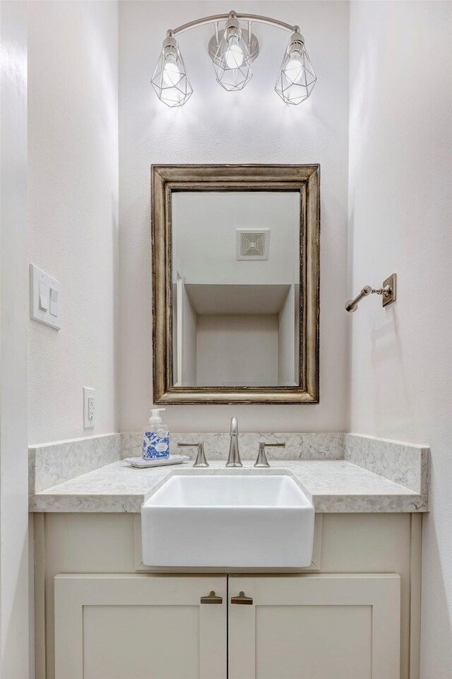 bathroom with visible vents and vanity